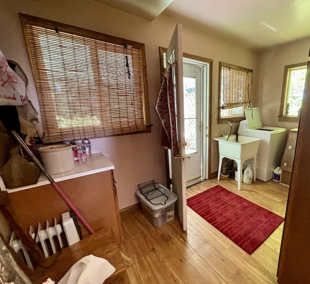 interior space featuring hardwood / wood-style floors and washer and dryer