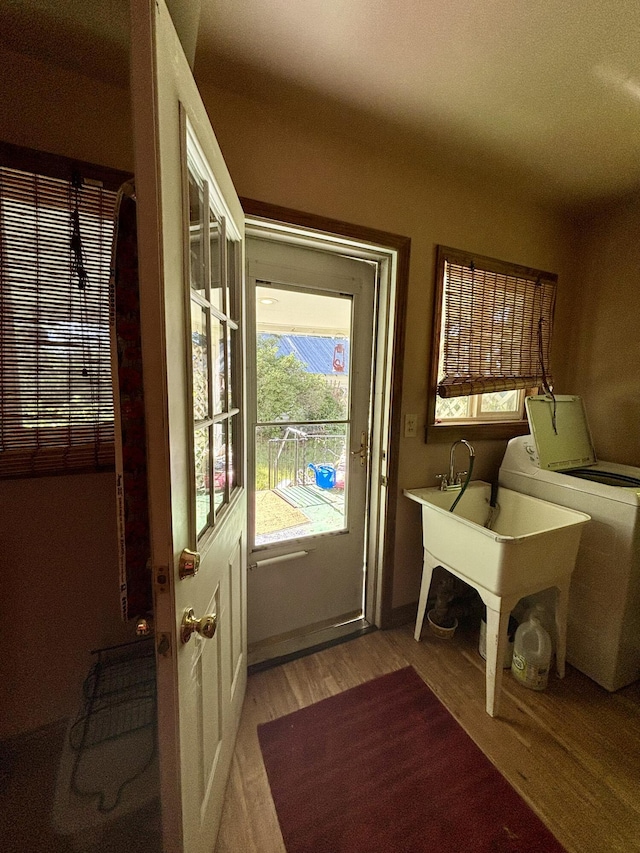 entryway featuring washer / dryer and light hardwood / wood-style floors