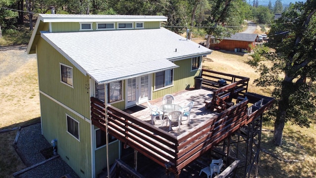 back of house with french doors and a deck