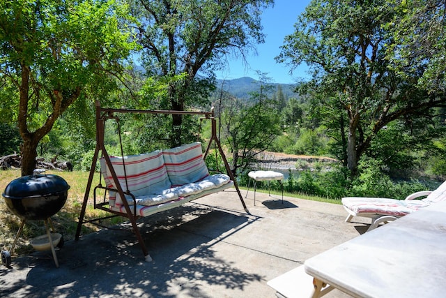 view of patio with a mountain view and outdoor lounge area