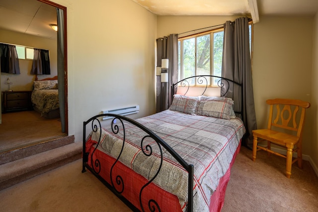 bedroom featuring light colored carpet, vaulted ceiling, and a baseboard heating unit