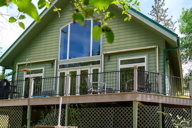 back of house featuring a deck