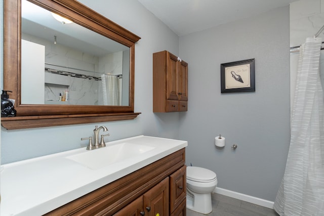 bathroom featuring vanity, curtained shower, and toilet