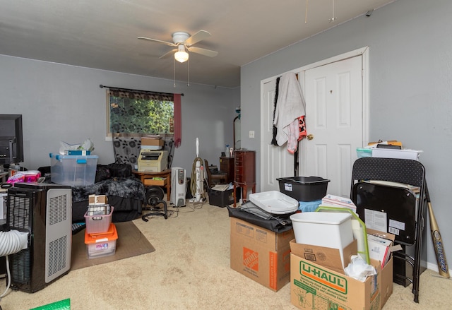 miscellaneous room with ceiling fan and light colored carpet