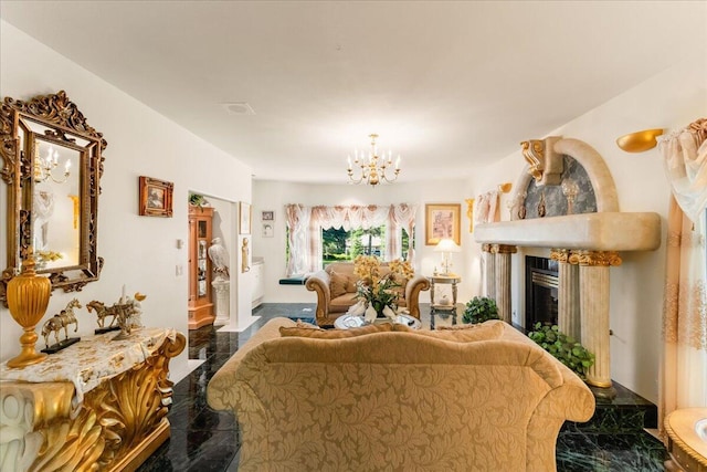 living room featuring a high end fireplace and an inviting chandelier