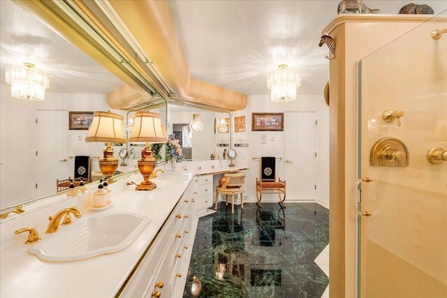 kitchen featuring hanging light fixtures, a notable chandelier, and sink