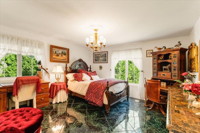 bedroom with an inviting chandelier