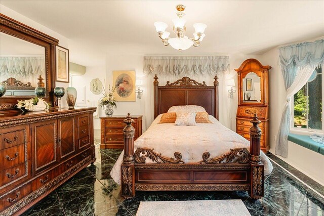 bedroom featuring an inviting chandelier