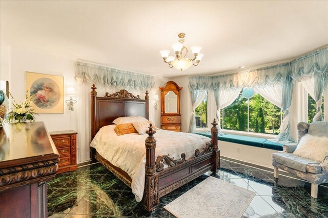 bedroom featuring a chandelier