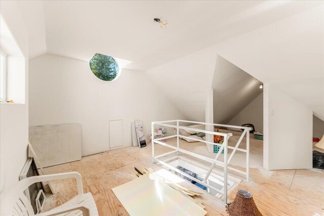 bonus room featuring lofted ceiling