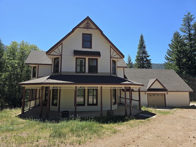 view of front of property featuring a garage and a porch