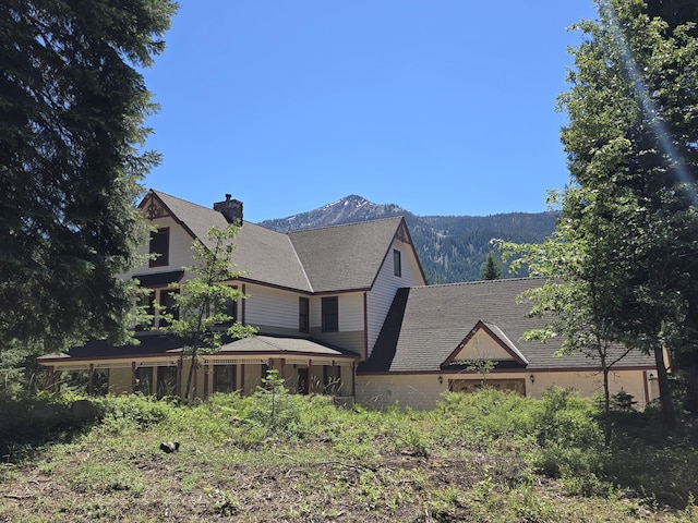 view of front of property with a mountain view