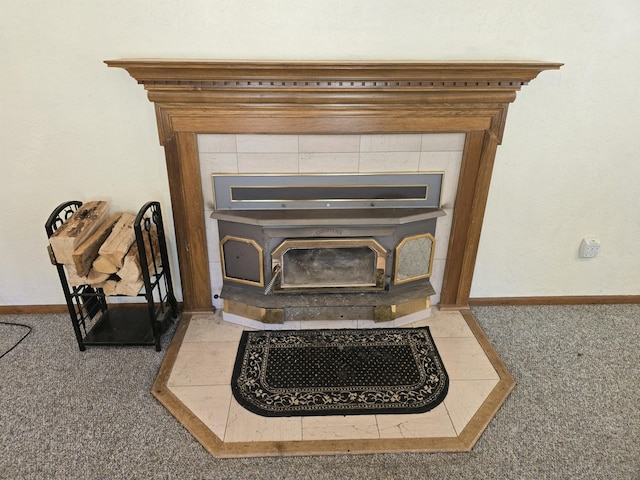 interior details with carpet and a wood stove