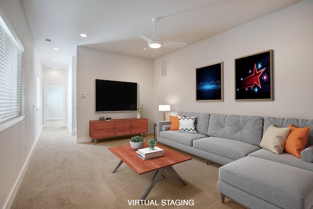 living room with light colored carpet and ceiling fan