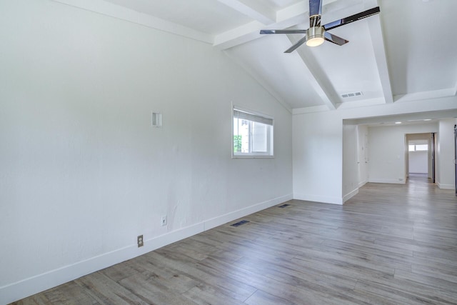 unfurnished living room featuring ceiling fan, baseboards, vaulted ceiling with beams, wood finished floors, and visible vents