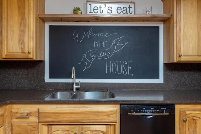 kitchen featuring a sink, dark countertops, and black dishwasher
