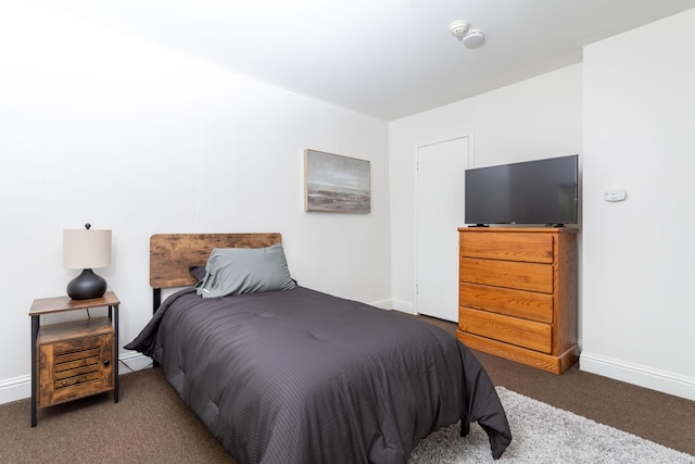 carpeted bedroom with baseboards