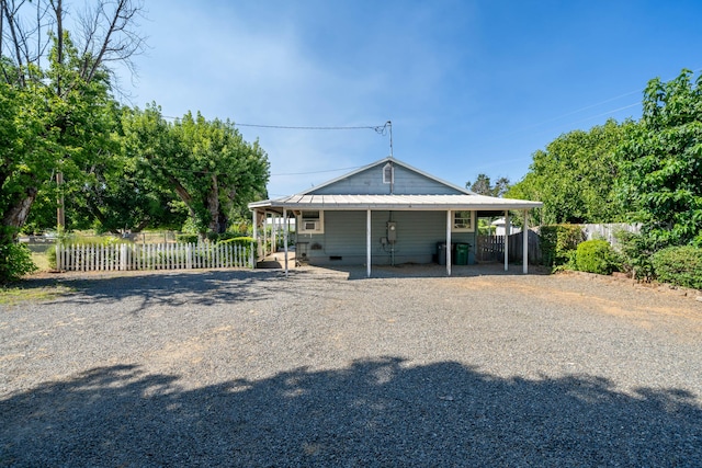 view of front of home with a carport