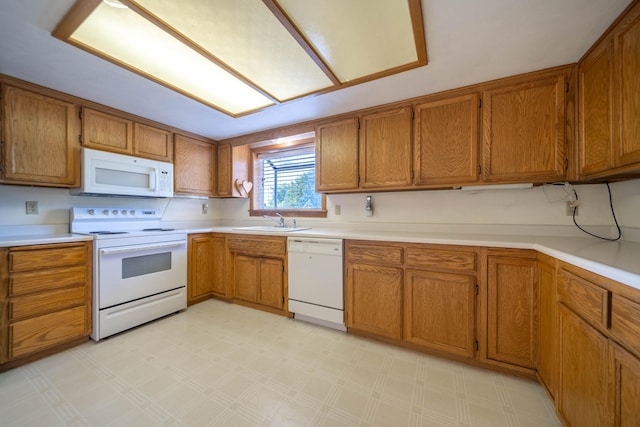 kitchen with white appliances and sink