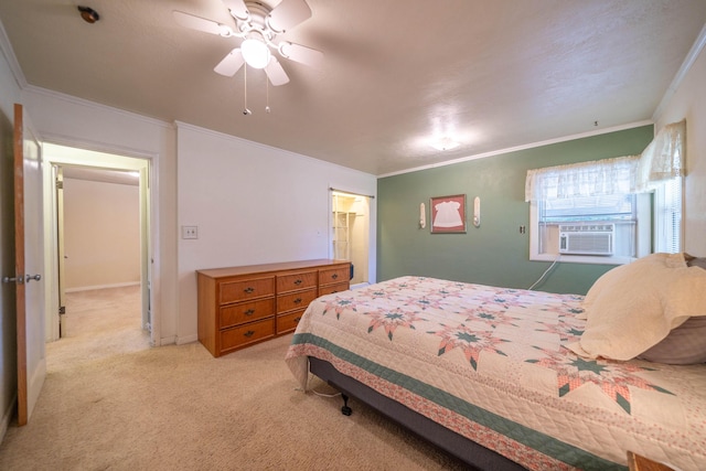 bedroom featuring cooling unit, light carpet, ornamental molding, and ceiling fan