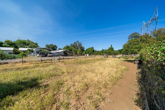 view of yard with a rural view