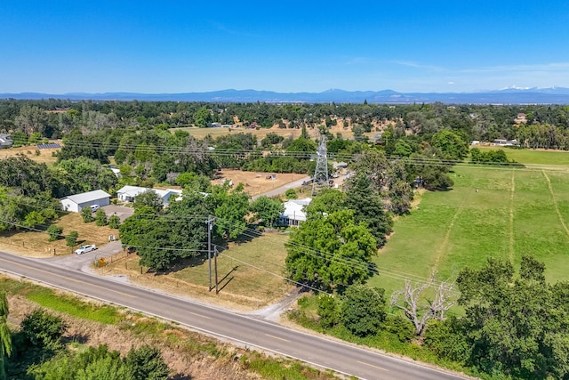 birds eye view of property with a mountain view