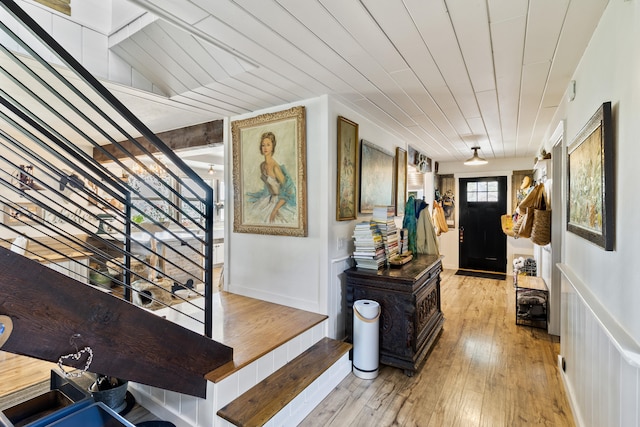 interior space with wood ceiling and light wood-type flooring