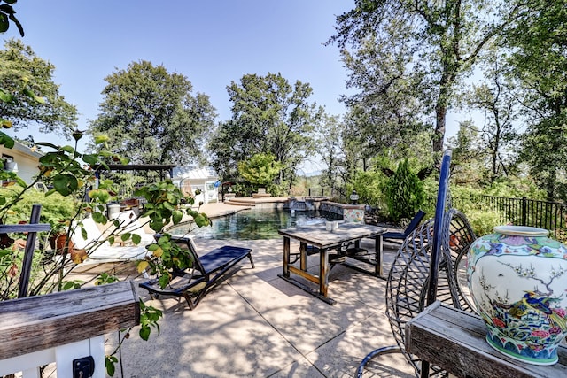 view of patio with a fenced in pool