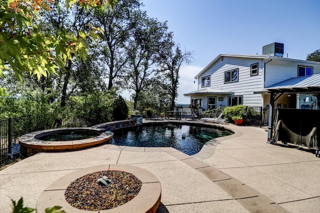 view of pool with an in ground hot tub, central AC, and a patio area