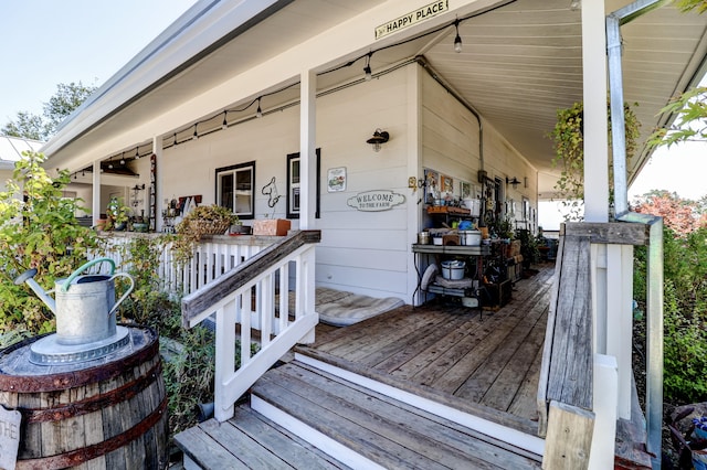 wooden terrace with a porch