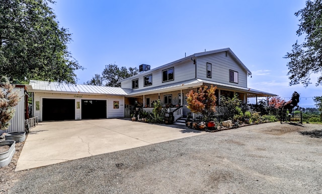 view of front of home featuring a garage and covered porch