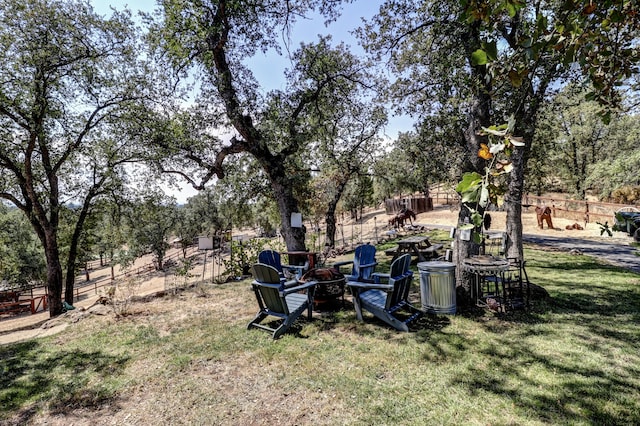 view of yard with a fire pit