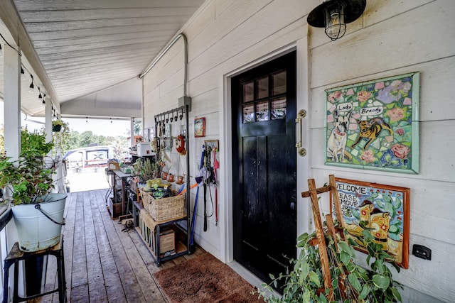 wooden terrace featuring covered porch