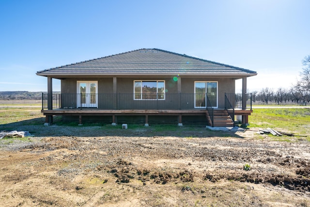 rear view of property with french doors