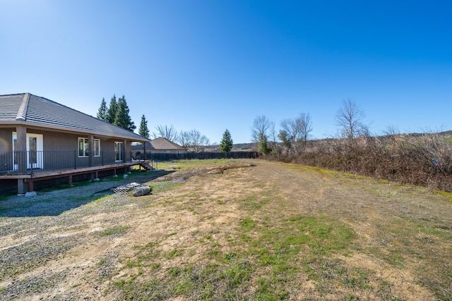 view of yard featuring a wooden deck