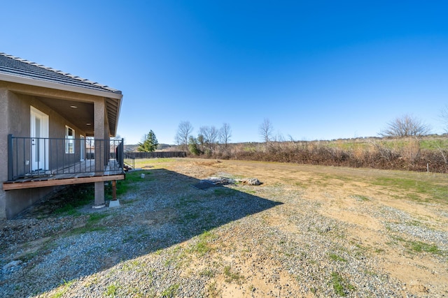 view of yard with a deck