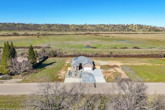 birds eye view of property featuring a rural view