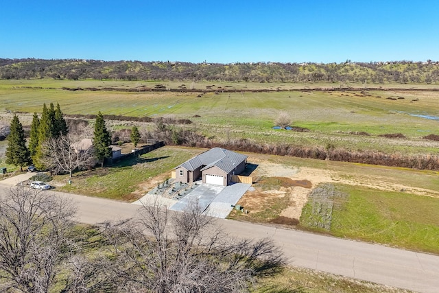 birds eye view of property featuring a rural view