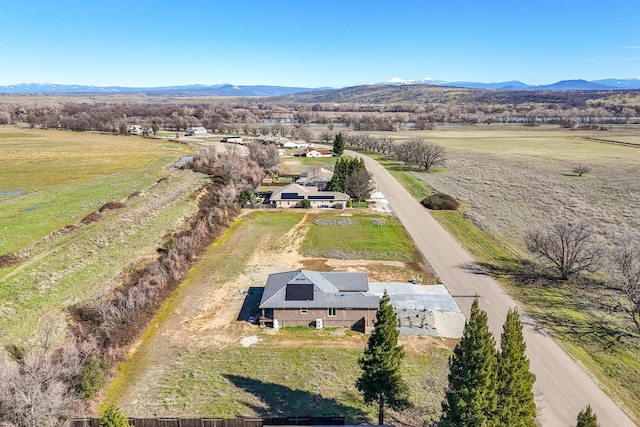 bird's eye view featuring a rural view and a mountain view