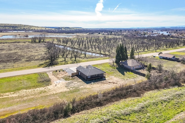 aerial view featuring a rural view and a water view