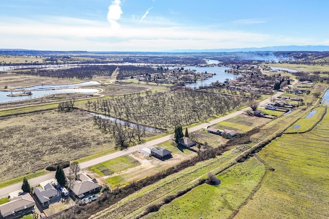 drone / aerial view with a water view and a rural view