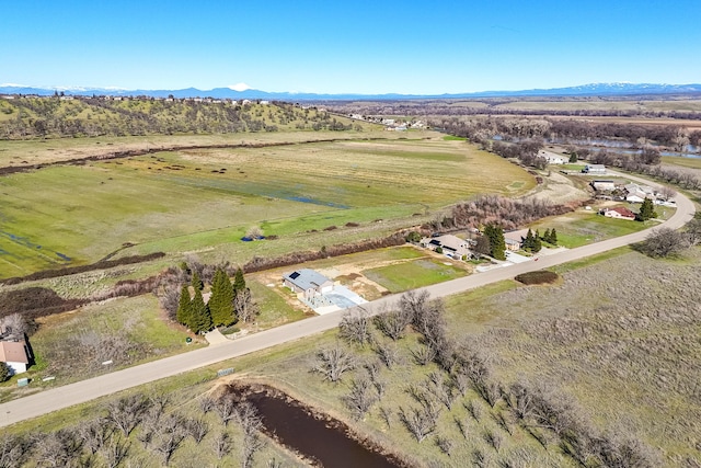 drone / aerial view featuring a rural view and a mountain view