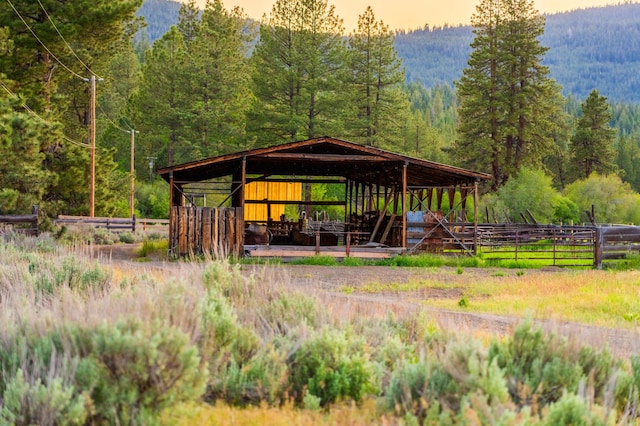 exterior space featuring a mountain view and an outbuilding