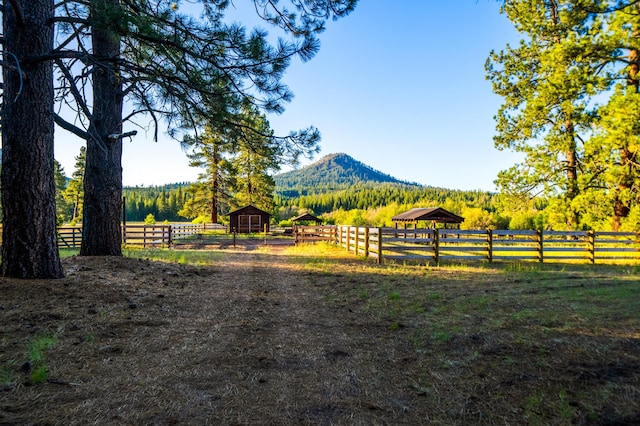 exterior space with a mountain view and a rural view