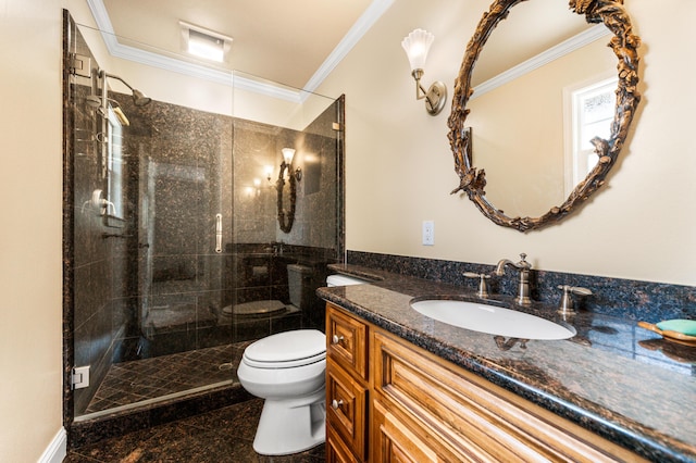 bathroom with vanity, toilet, a shower with shower door, and ornamental molding