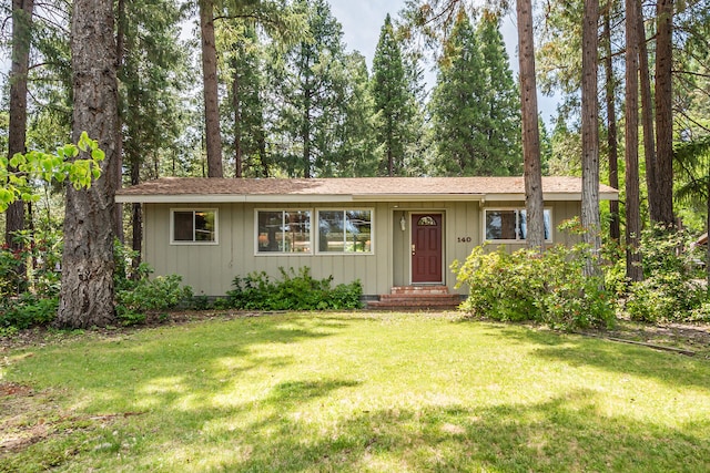 ranch-style house with a front lawn