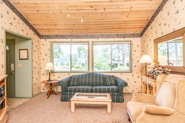 living room with wooden ceiling, carpet flooring, a healthy amount of sunlight, and vaulted ceiling