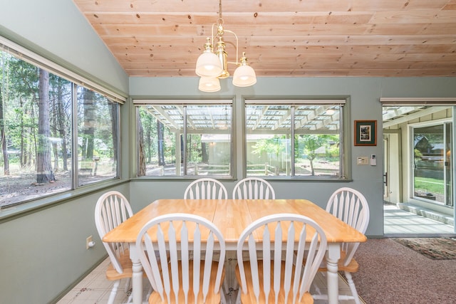 carpeted dining space with a notable chandelier, vaulted ceiling, and wooden ceiling