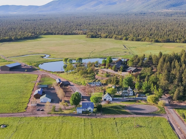 aerial view featuring a water and mountain view