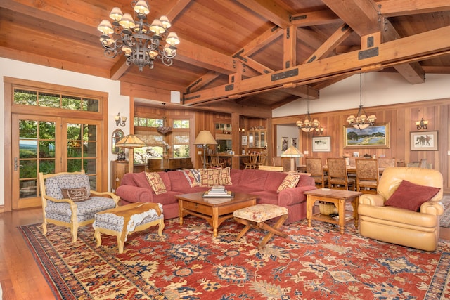 27744 Lee Rd, Mcarthur, CA 96056 - living room featuring a notable chandelier, wood ceiling, hardwood / wood-style flooring, wood walls, and beamed ceiling
